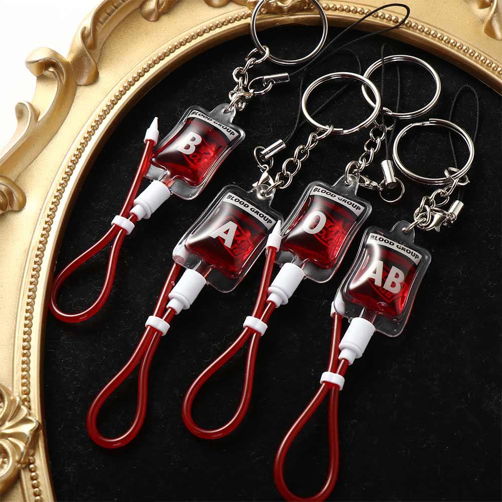 Phone Accessories Unique - سلسلة مفاتيح على شكل كيس دم