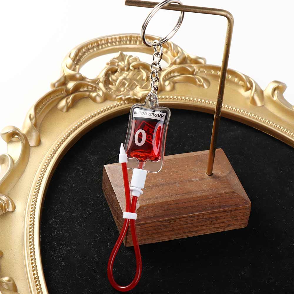 سلسلة مفاتيح على شكل كيس دم بل - مراجعة Phone Accessories Unique وسعره