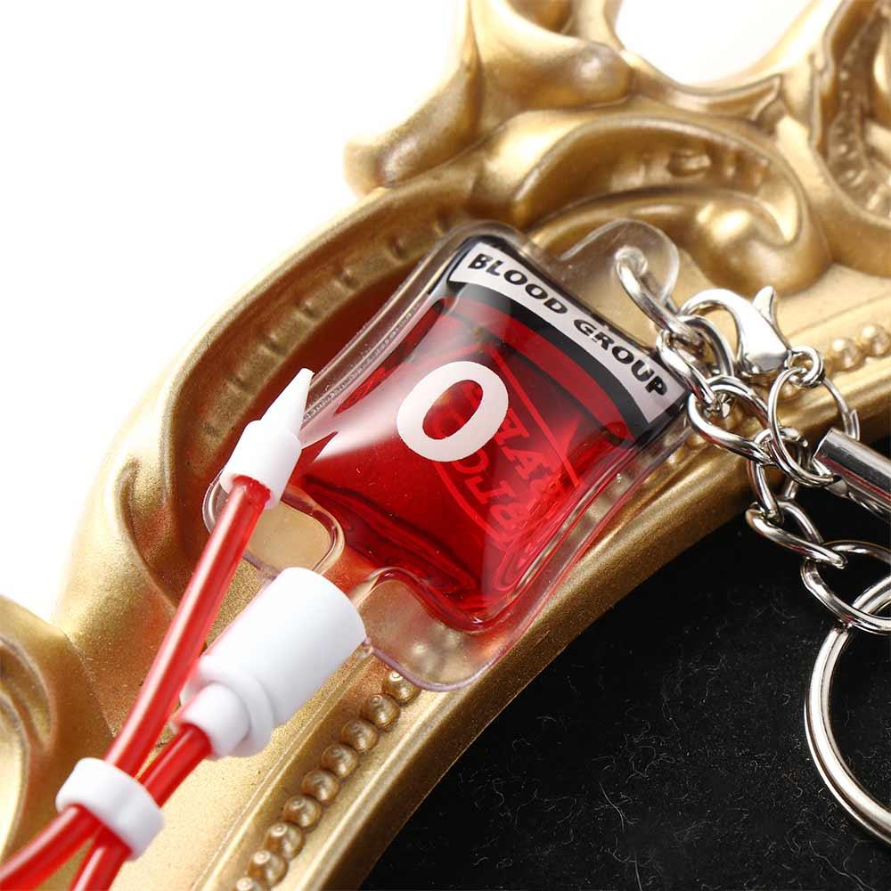 ميدالية مفاتيح على شكل كيس دم  - مراجعة Phone Accessories Unique وسعره