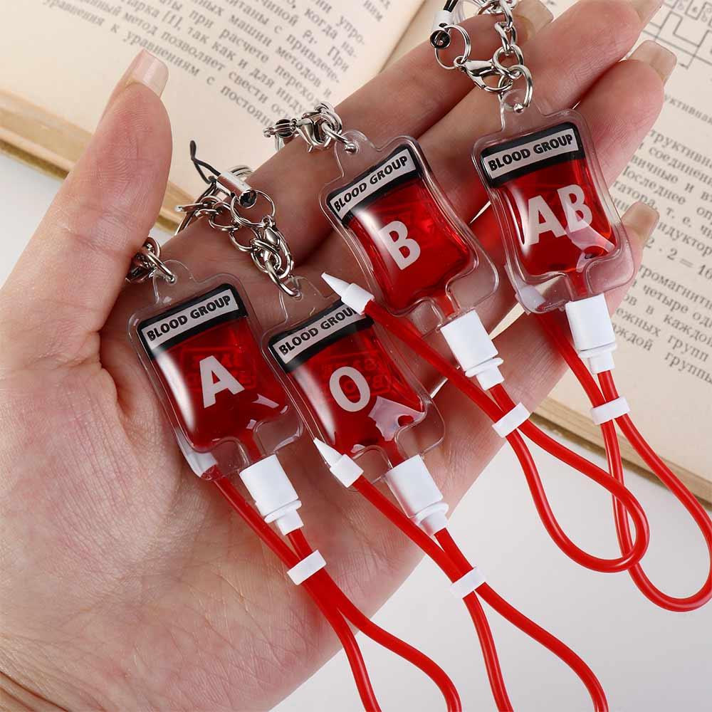 ميدالية مفاتيح على شكل كيس دم  - مراجعة Phone Accessories Unique وسعره